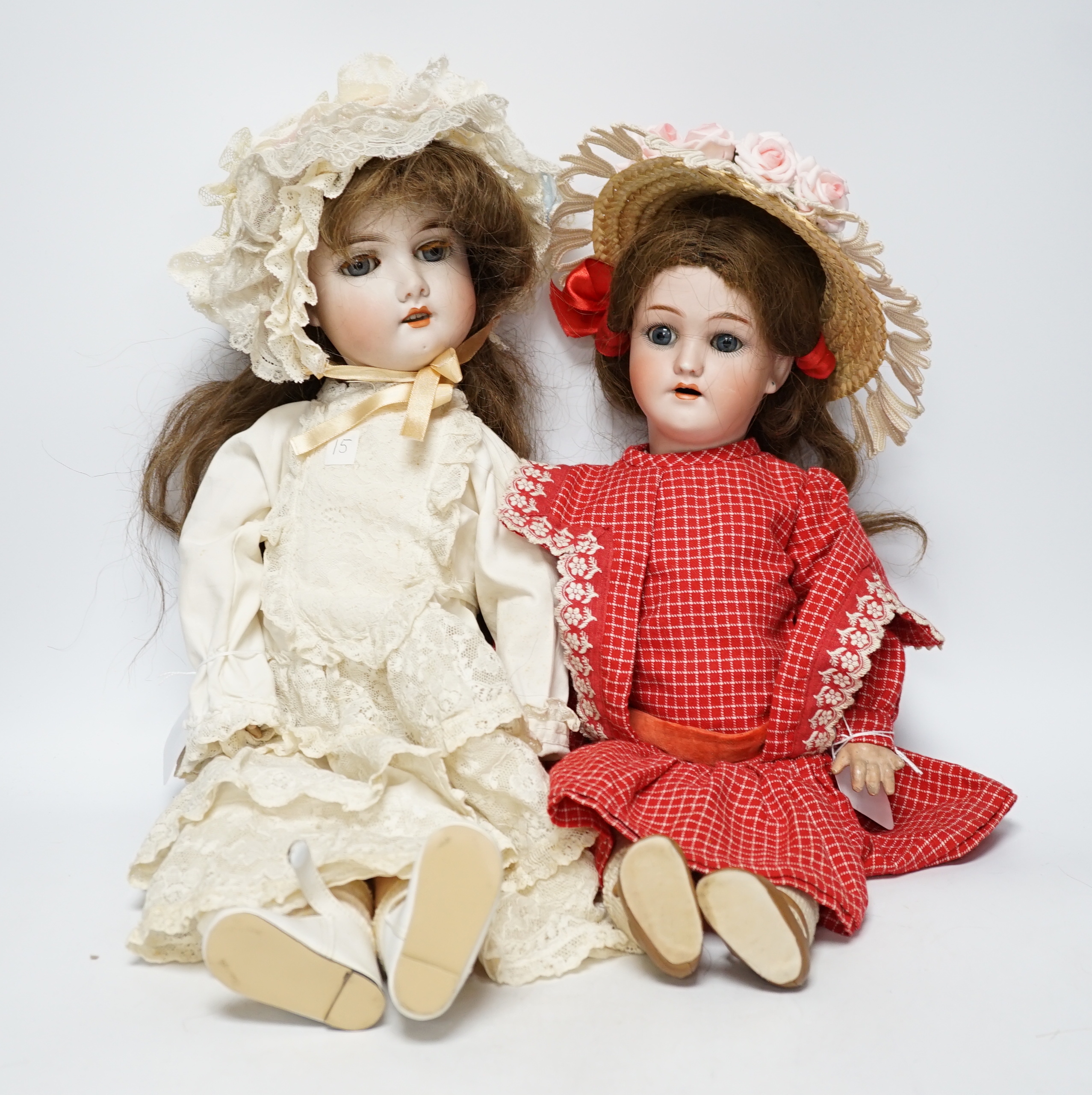 A Gebruder Kuhnlenz K168 doll, 58cm, good condition, and a Heinrich Handwerck Simon & Halbig doll, 45cm